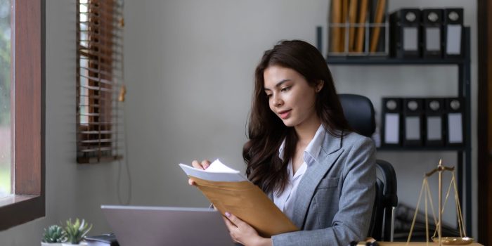 Asian lawyer woman working with a laptop computer in a law office. Legal and legal service concept
